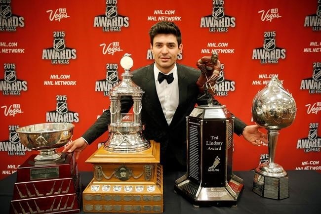 FILE PHOTO - Carey Price of the Montreal Canadiens poses with, from left, the William M. Jennings trophy, the Vezina Trophy, the Ted Lindsay Award trophy and the Art Ross trophy after winning the awards at the NHL Awards show in Las Vegas on June 24, 2015.