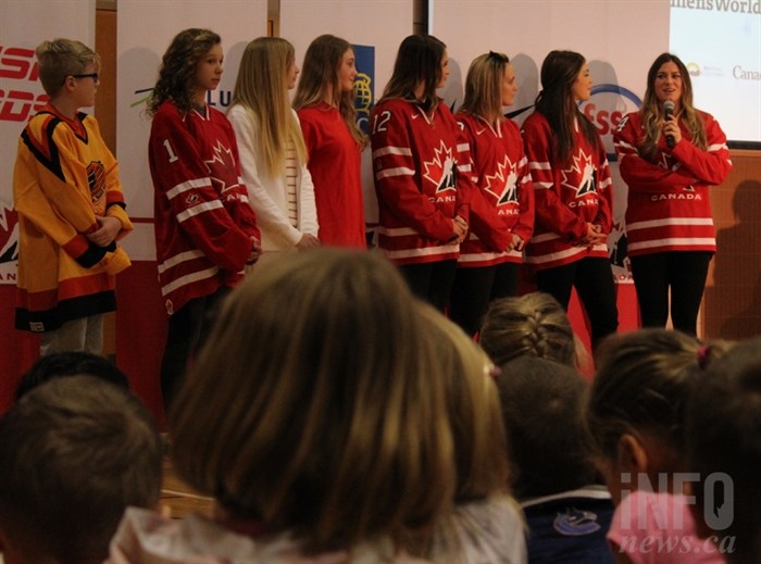 Students at Pacific Way Elementary School and Team Canada members listen to Natalie Spooner, 26.