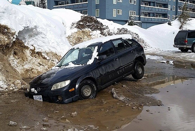 A visitors car got stuck in the parking lot of The Market at the Big White Village Sunday, March 6, 2016.