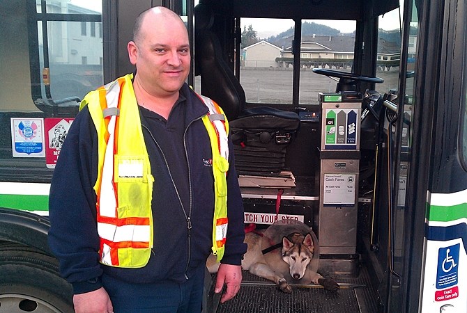 Kelowna bus driver Clayton Bouchard and Shadow, an injured dog that boarded his #11 bus Thursday morning.