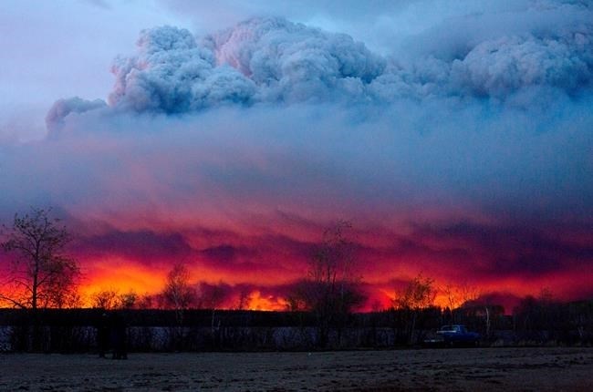 A wildfire moves towards the town of Anzac from Fort McMurray, Alta., on Wednesday, May 4, 2016.