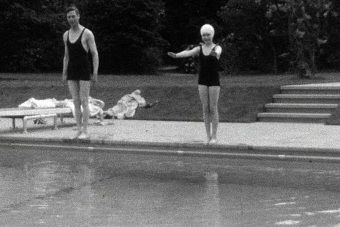 This undated handout photo provided by HM The Queen shows the then Princess Elizabeth swimming with her father, King George VI in Britain.