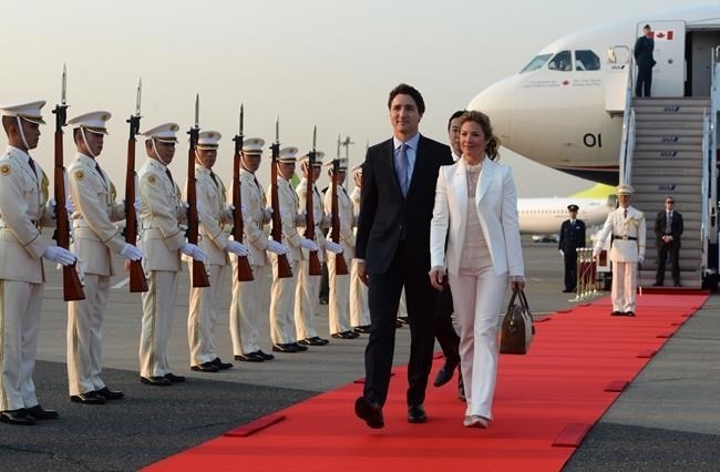 FILE PHOTO - Prime Minister Justin Trudeau and his wife Sophie Gregoire Trudeau are greeted by an honour guard as they arrive in Tokyo, Japan on Monday, May 23, 2016. 