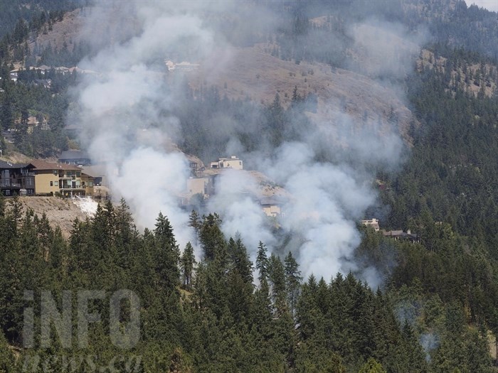 Firefighters are on the scene of a grassfire above Westside Road in West Kelowna, Friday, June 17, 2016.