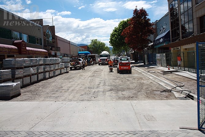 Paving stones arrive on the street in bulk for placement on the sidewalks and street intersections in this May 9 photo.