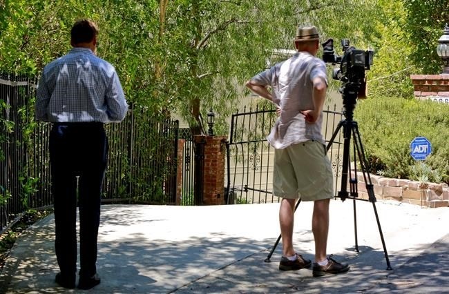 Television reporters record the driveway to the home of Anton Yeltsin, 27, in the Studio City area of Los Angeles, on Sunday, June 19, 2016. The rising actor best known for playing Chekov in the new 