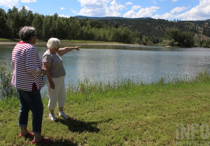 Betty Timuss points to where they spotted a girl's head bobbing in the water.