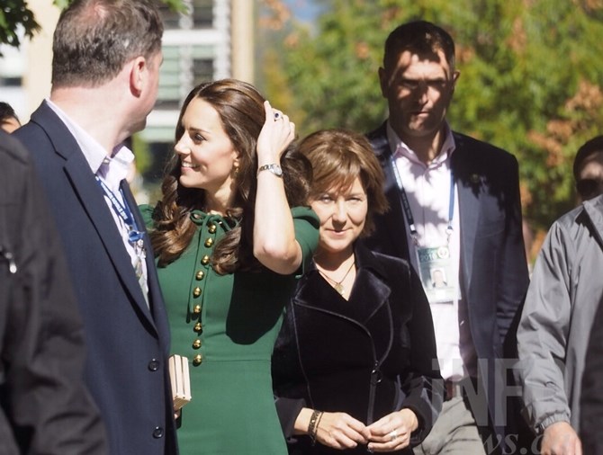 The Duchess of Cambridge was surrounded by security personnel as she made her way to ceremonies at UBC Okanagan.