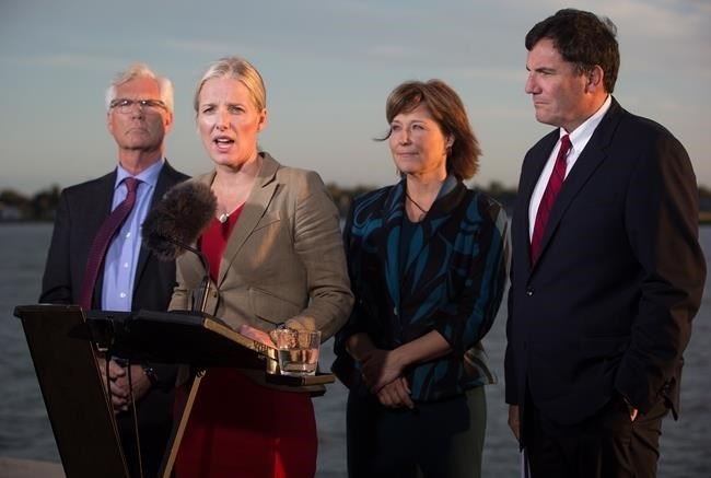 Catherine McKenna, second left, Minister of Environment and Climate Change, speaks while flanked by Jim Carr, from left to right, Minister of Natural Resources, British Columbia Premier Christy Clark and Dominic LeBlanc, Minister of Fisheries, Oceans and the Canadian Coast Guard, after the federal government announced approval of the Pacific NorthWest LNG project, at the Sea Island Coast Guard Base, in Richmond, B.C., on Tuesday September 27, 2016.
