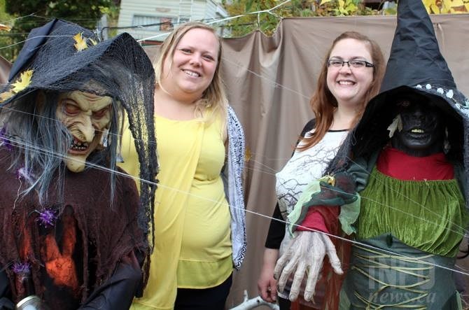Elyse Nelson (left) and Christina Bagg (right) amongst their witches in the haunted maze at 3121 Archibald Pl.