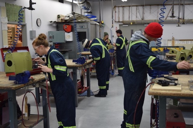 Students training in Okanagan College’s AME-S facility at the Kelowna Airport