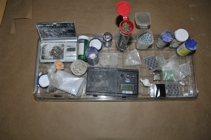 Different drugs and paraphernalia seized during the drug bust.