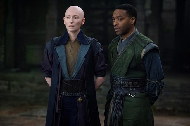 This image released by Disney shows Tilda Swinton, left, and Chiwetel Ejiofor in a scene from Marvel's 