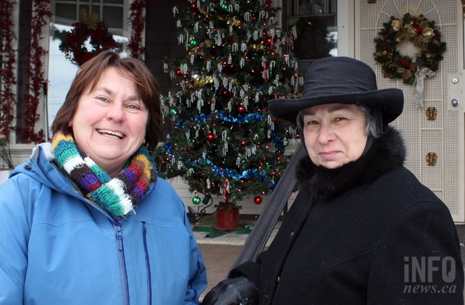 FILE PHOTO - Bernie Crawford (left) helped Louise Edwards (right) with her epic christmas decorations in 2016 at 607 Pine St. The candy cane tree can be seen between the two.