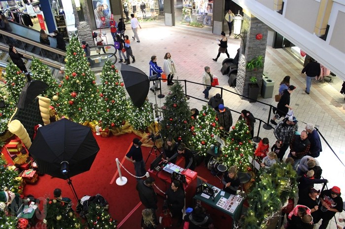 Shoppers crowd around Santa at Aberdeen Mall in Kamloops, Thursday, Dec. 22, 2016.
