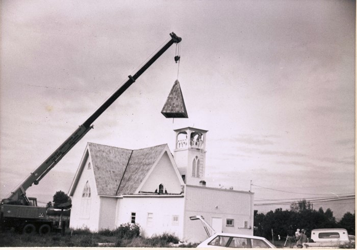 Raising the steeple of the church - date not known. 