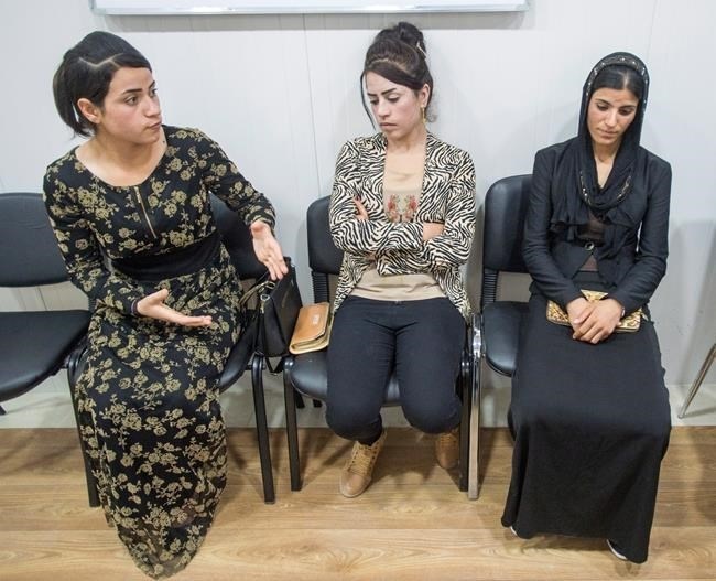 ISIS survivors Suham Haji, left, Samira Hasan, center, and Saud Khalid, right, sit in the Dohuk Girls and Women Treatment and Support Centre, Wednesday, February 22, 2017 in Dohuk, Iraq. The three women are among the 900 being treated at the centre after being kidnapped and sold multiple times before escaping captivity by the extremist group.