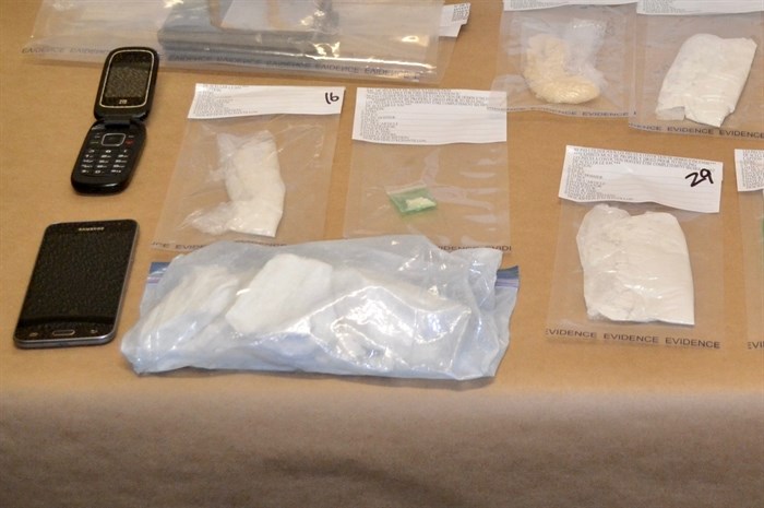 Suspected illicit drugs, cellular phones and a digital scale are pictured in this image submitted by RCMP.