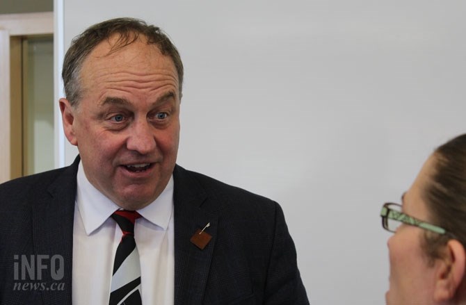 FILE PHOTO - B.C. Green Party leader Andrew Weaver speaking to a supporter at Thompson Rivers University March 27, 2017.