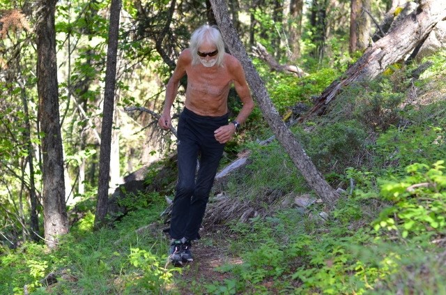 Dag runs along one of the trails he built in the North Okanagan backcountry. 