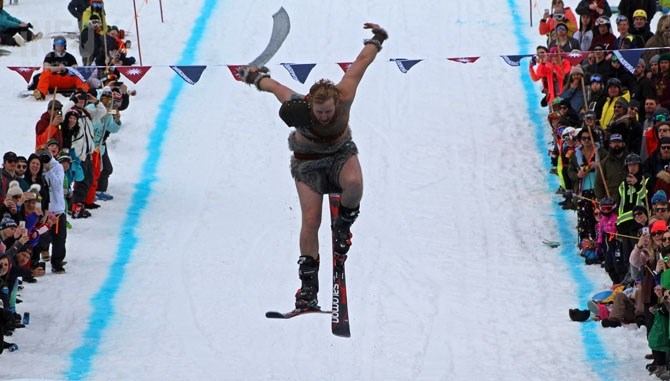 A participant in the slush cup competition was dubbed the Canadian Barbarian by commentators as he came down the hill.