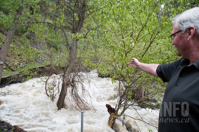 Glenn Grant says over the past 12 hours, the creek has eroded at least five feet of trail. 