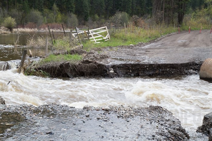 Campbell Creek Road is getting thrashed with floodwater.