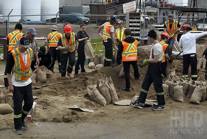 Rutland Secondary students volunteer filling sand bags at a location on Adams Road, Thursday, May 11, 2017.