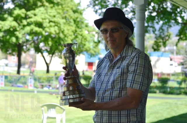 David Nagy holds a lawn bowling trophy from 1929. 