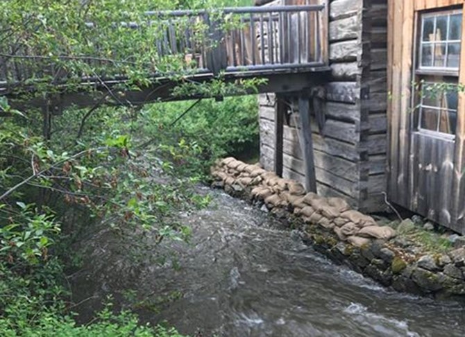 The Keremeos Grist Mill was sandbagged last night, May 24, 2017, after Keremeos Creek rose to within eight inches of the mill foundation.