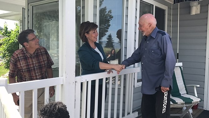 Premier Christy Clark, along with Penticton MLA Dan Ashton, left, visited residents at the Red Wing Resort near Penticton Tuesday, June 6, 2017. Several home are threatened by the rising water in  Okanagan Lake.