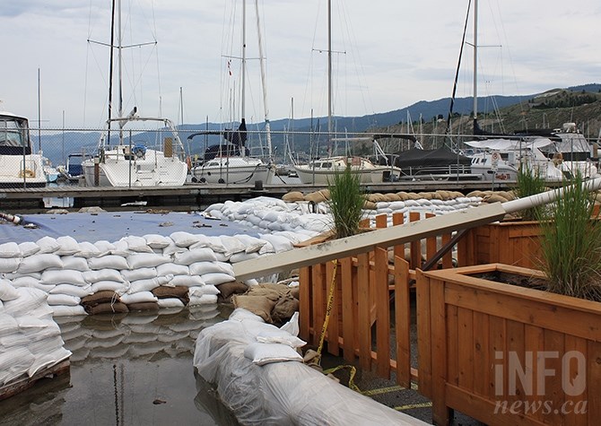 Water continues to seep under the sandbag wall protecting the Penticton Yacht Club's clubhouse from Okanagan Lake.