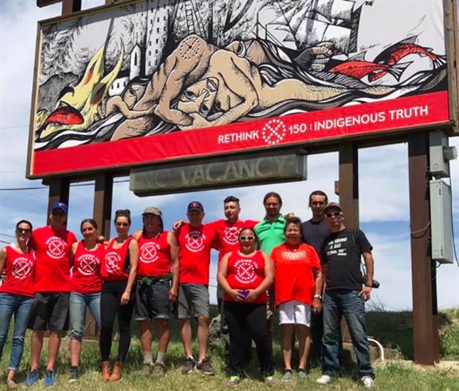 Members and volunteers of the Rethink 150 collective after posting their second billboard at the north end of Duck Lake in Lake Country on June 17, 2017.
