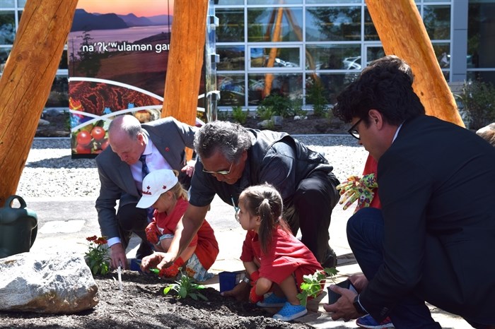 Children from Little Scholars daycare joined by OC President Jim Hamilton, WFN Elder Grouse Barnes and WFN Councillor and Okanagan College Board of Governors Vice Chair Chris Derickson in planting the final six plants in the garden.