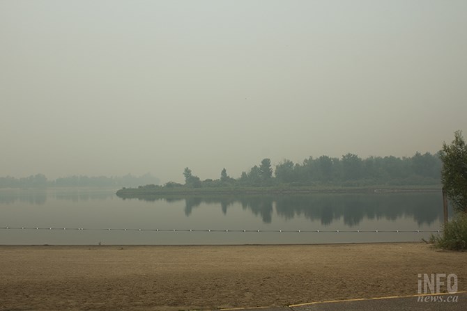 Across the river from Riverside Park, you might mistake the smoke from nearby wildfires for a thick fog.