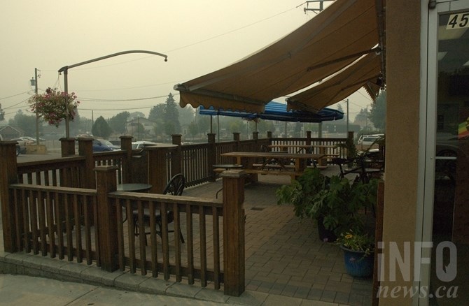 The patio at Jamaican Kitchen is also empty as customer huddle inside to avoid the smoke.