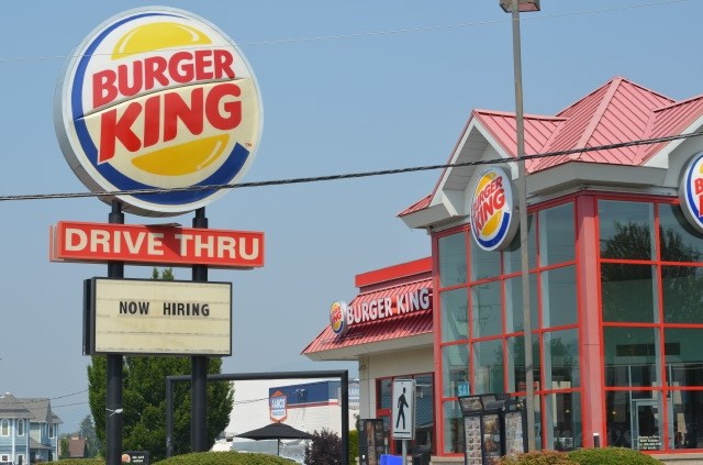 A 'now hiring' sign seen at the Vernon Burger King on July 31, 2017. 