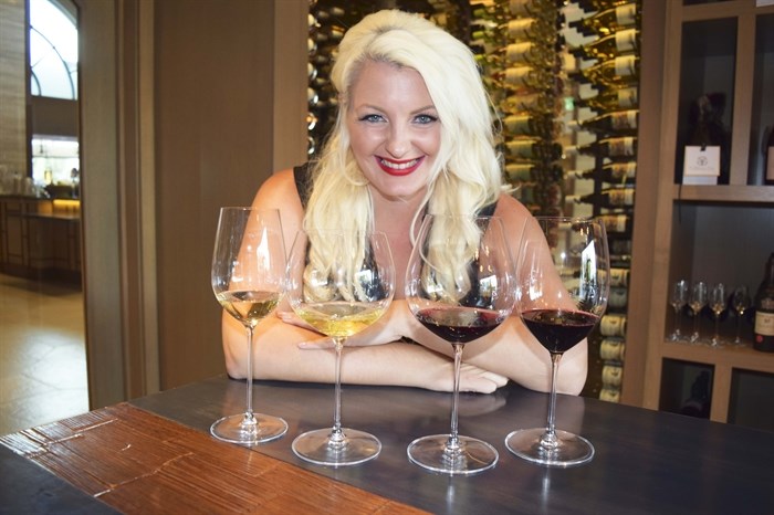 Alysha Harker of Riedel Crystal is pictured with four wine varietals in their appropriate glasses.