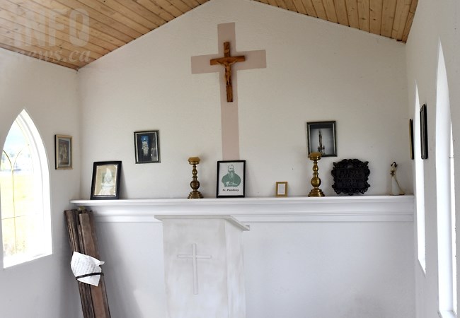 A photograph of Father Charles Pandosy inside the small church near Kelowna's first cemetery. 