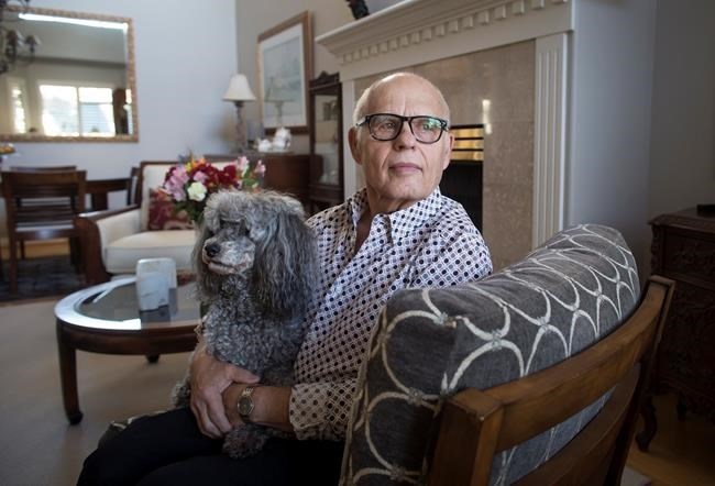 Max Morton, 81, sits with his dog Barney at his home in Richmond, B.C., on Monday October 30, 2017. Morton is one of 411 patients who had transcatheter aortic valve replacement surgery where the damaged aortic valve is replaced without removing the old one. The procedure is an alternative to the more invasive open-heart surgery. 