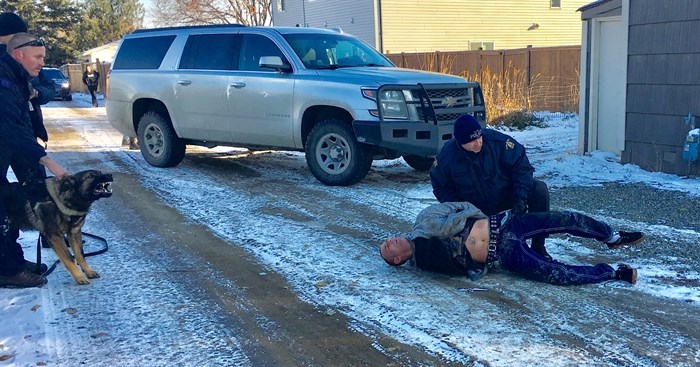 This photo shows Kamloops RCMP officers detaining Michael Shawn Boyer on Nov. 6, 2017 outside of a home on Fortune Drive.
