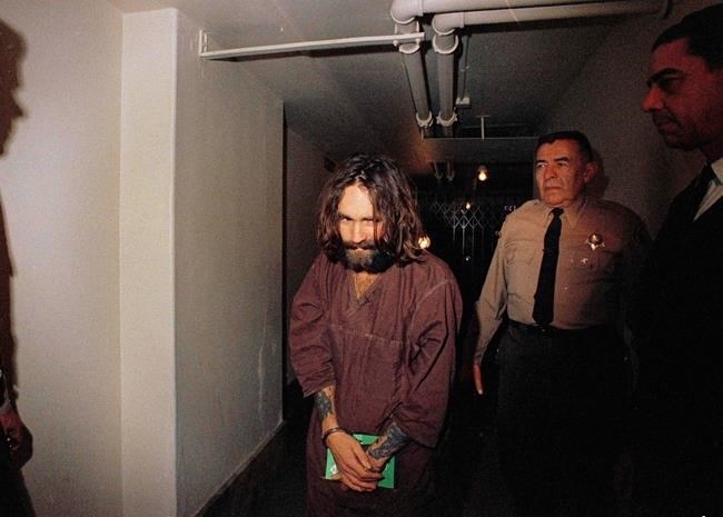 FILE PHOTO - In this 1969 file photo, Charles Manson is escorted to court in Los Angeles during an arraignment phase.