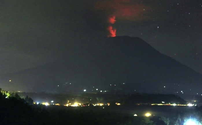A view of the Mount Agung volcano erupting, in Karangasem, Bali island, Indonesia, early Sunday, Nov. 26, 2017.