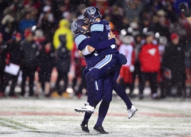 Toronto Argonauts kicker Lirim Hajrullahu (70) celebrates his field goal with backup quarterback Cody Fajardo (17) during second half CFL football action in the 105th Grey Cup on Sunday, November 26, 2017 in Ottawa.
