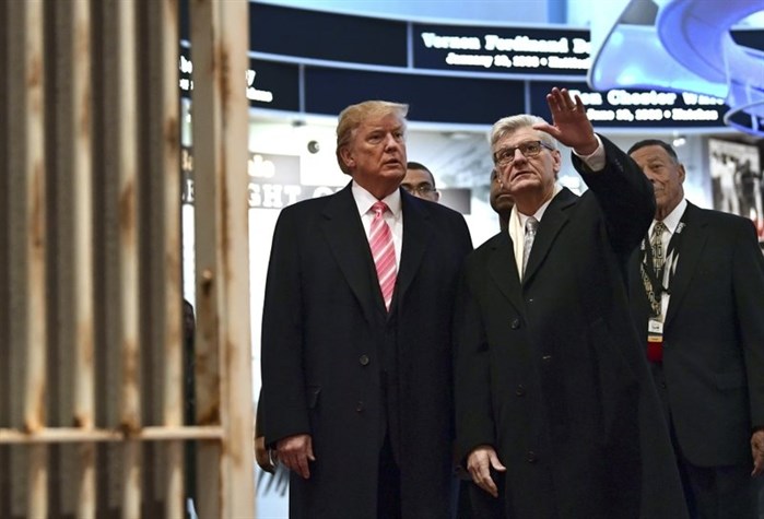 Trump, left, listens as Mississippi Gov. Phil Bryant, right, shows him the Hinds County Jail on display at the newly-opened Mississippi Civil Rights Museum in Jackson, Miss., Saturday, Dec. 9, 2017.

