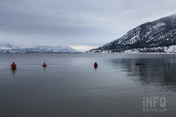 Members of Penticton Search and Rescue wait patiently for the stroke of noon at Sun-Oka Beach today, Jan. 1, 2018.