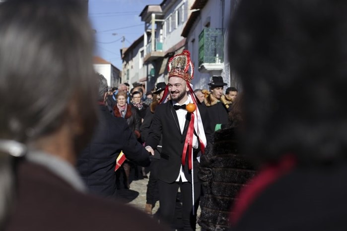 Gabrial Setas greets villagers after being chosen as the new “king” during the local Kings’ Feast in the village of Vale de Salgueiro, northern Portugal, Saturday, Jan. 6, 2018.
