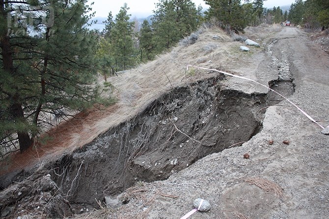A section of the Kettle Valley Rail Trail above Naramata remains closed Monday, March 26, 2018, following a major washout last week that resulted in a landslide encroaching on the residence below.