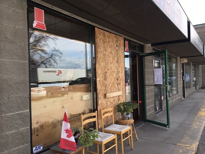 Nicolas & Marie's Pizza is boarded up where thieves smashed the window with a rock, but they're still open and looking at the bright side. 