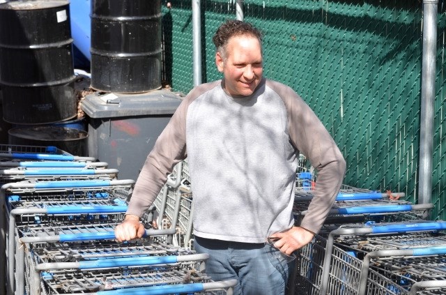 Patrick Vance with the carts that have accumulated at Interior Freight Bottle and Depot. 